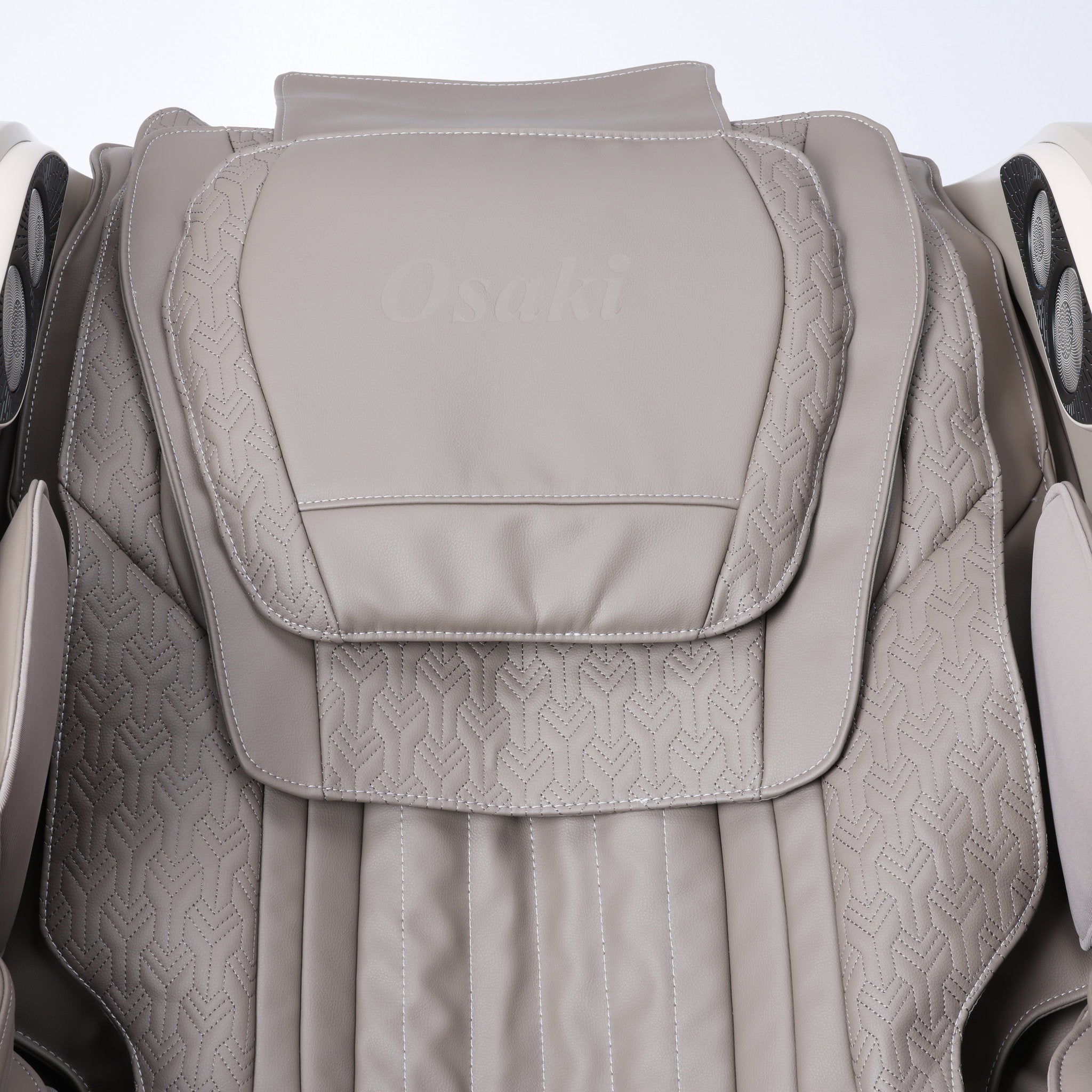 Osaki One Pro 4D massage chair in taupe — close-up of the quilted backrest and headrest